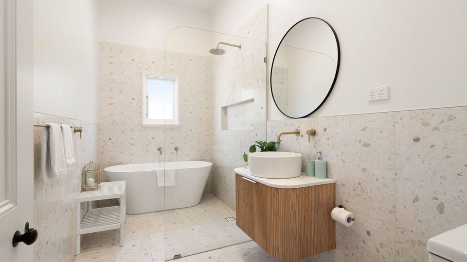 Wide view of the modern bathroom setup including the vanity and tub.