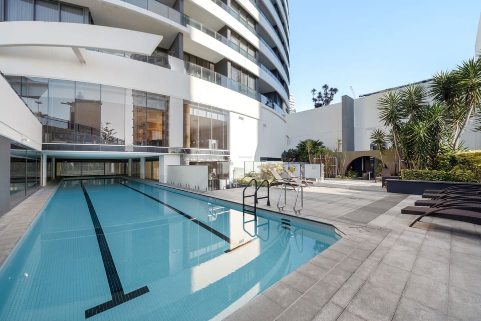The building's outdoor lap pool and sun deck, shared with residents