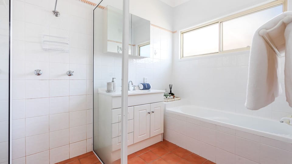 Beach Sanctuary | Bathroom | Bathtub | Shower | Vanity | Hair dryer | Hair straightener | Bodywash | Shampoo | Conditioner | Separate toilet