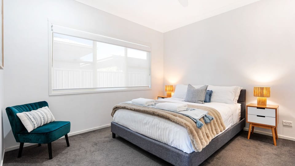 Beach Sanctuary | Bedroom 1 | Queen | Linen included | Ceiling fan | Heating | Travel Cot (BYO cot linen)