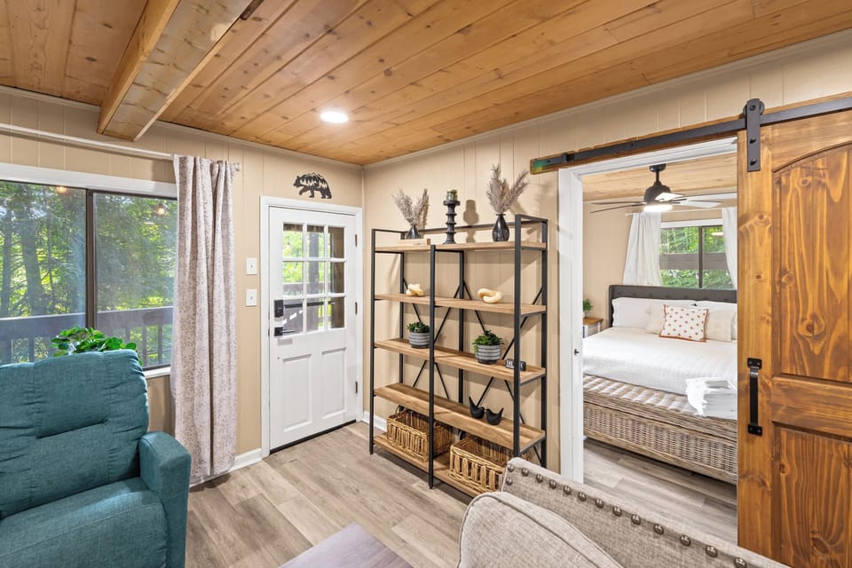 Living room w/ smart TV, fireplace & desk