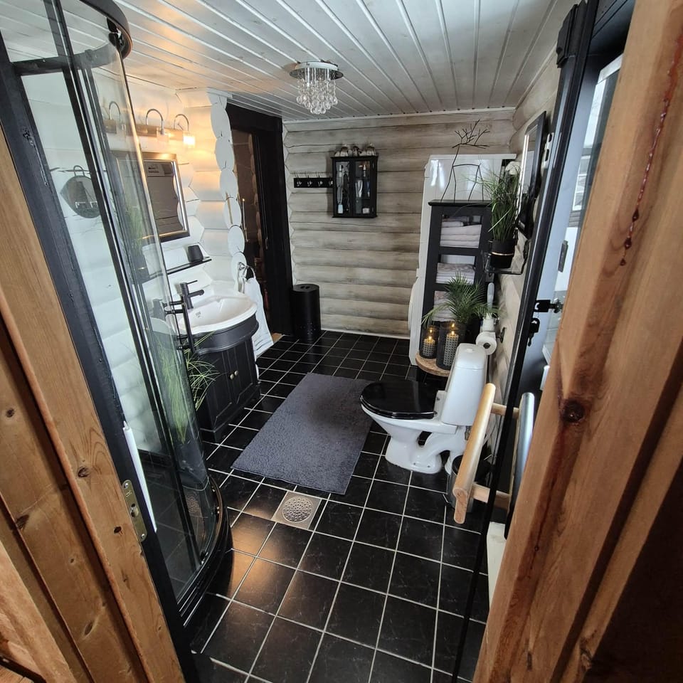 Bathroom with shower, washing machine and sauna
