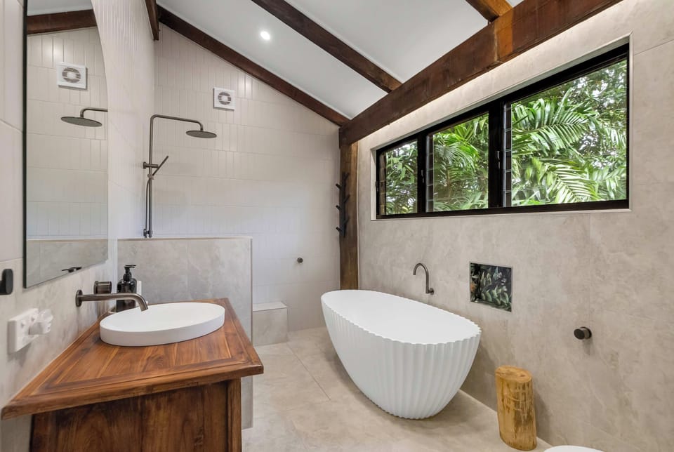 Enjoy your own space to refresh in the ensuite, with a bathtub and shower offering the choice of a restorative soak or a quick rinse.