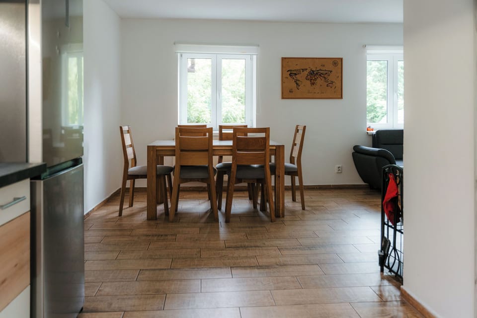 Bright open dining area with seating for six and plenty of natural light