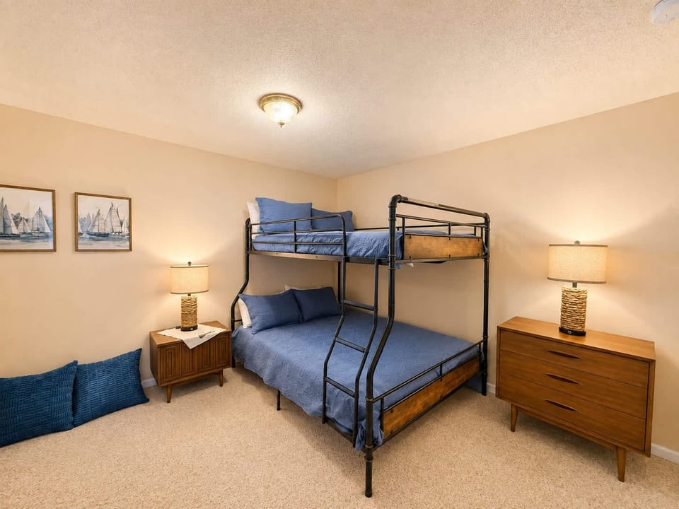 Waters Edge’s final bedroom includes a full-over-queen bunkbed & TV​