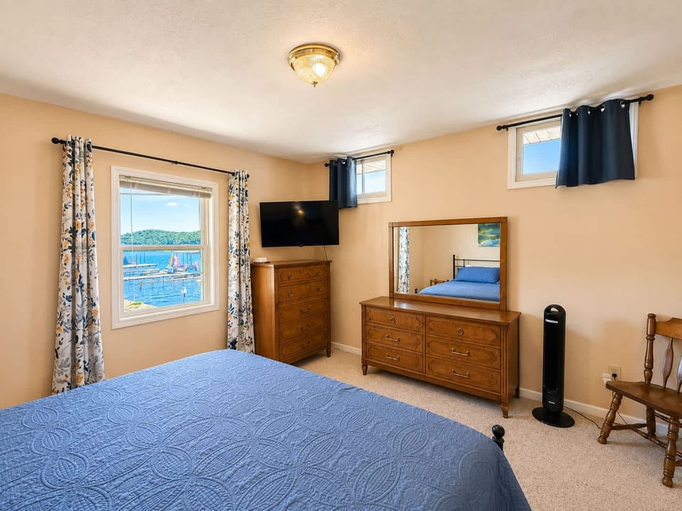 Recharge in Waters Edge’s first bedroom, offering a king bed & smart TV​