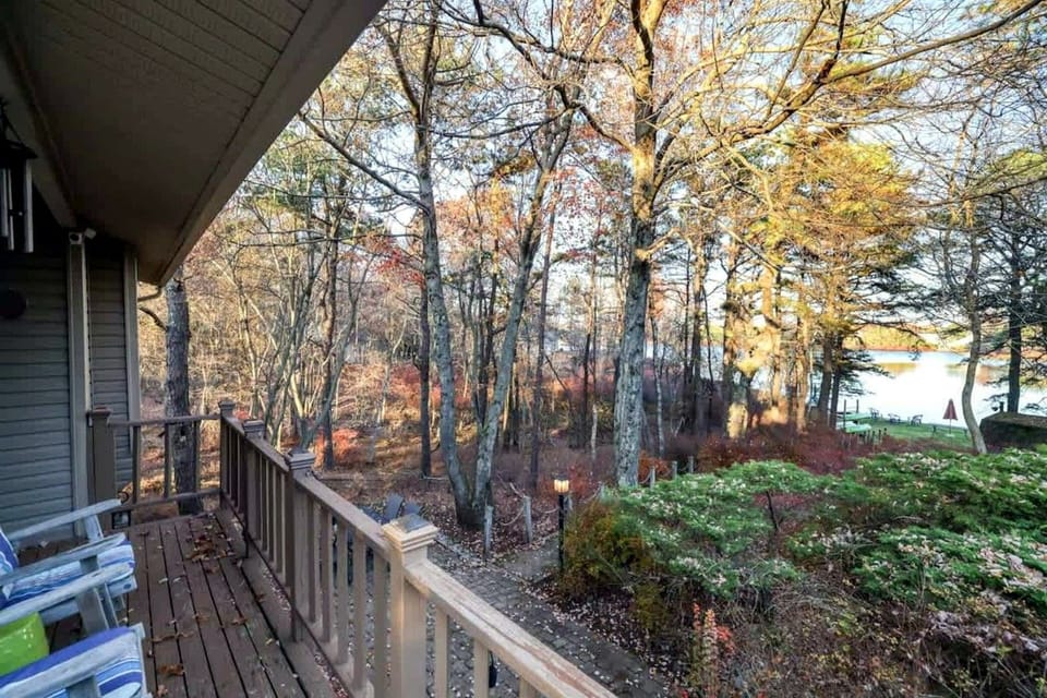 Step onto the deck for fresh mountain air and a glimpse of the lake through the trees.