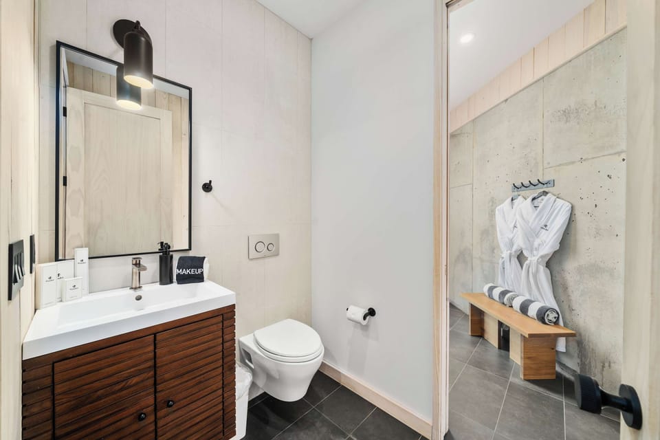Half Bath: (Main level) - Convenient half bath with a mudroom style bench and hooks, practical touches that make coming in from outside easy.