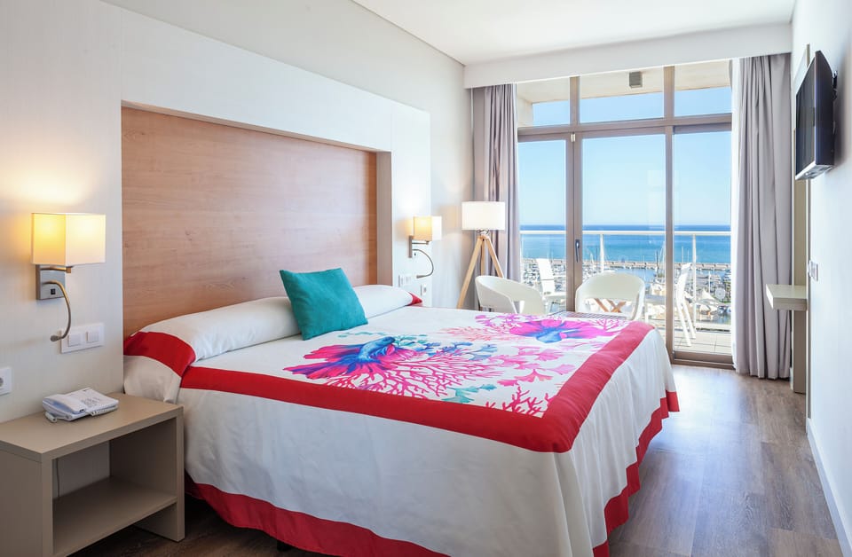 Double Room, Terrace, Sea View | Pillowtop beds, in-room safe, desk, laptop workspace