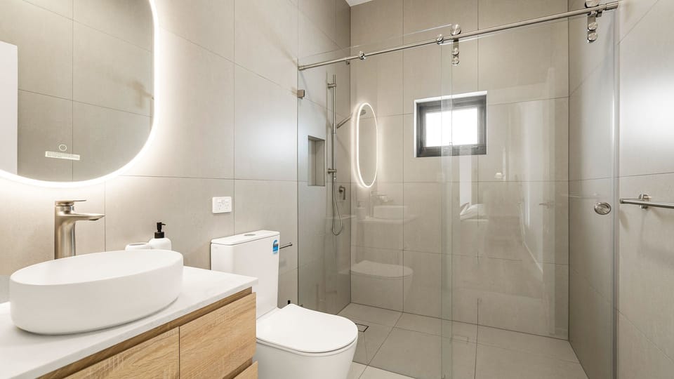Modern bathroom featuring a spacious glass shower.