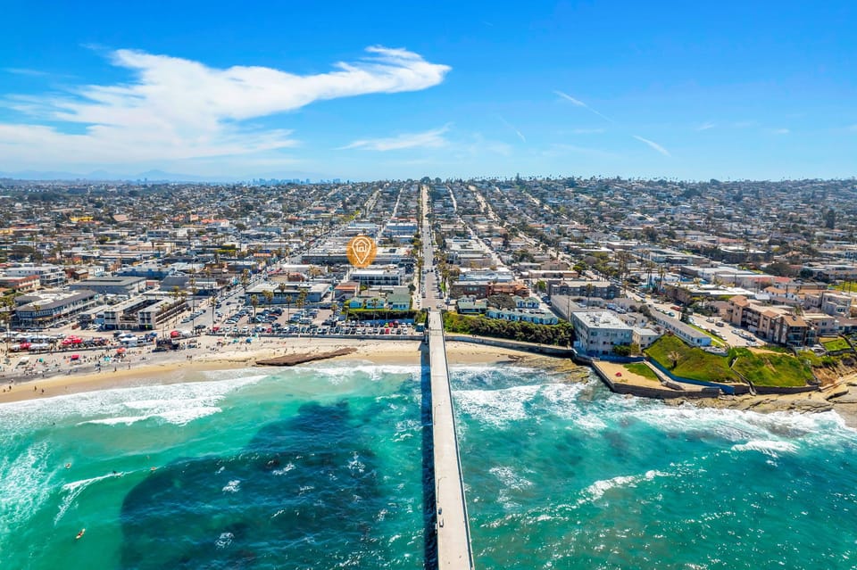 🌊 Aerial perspective on coastal living—the pier, the shoreline, the whole beach town laid out from above.