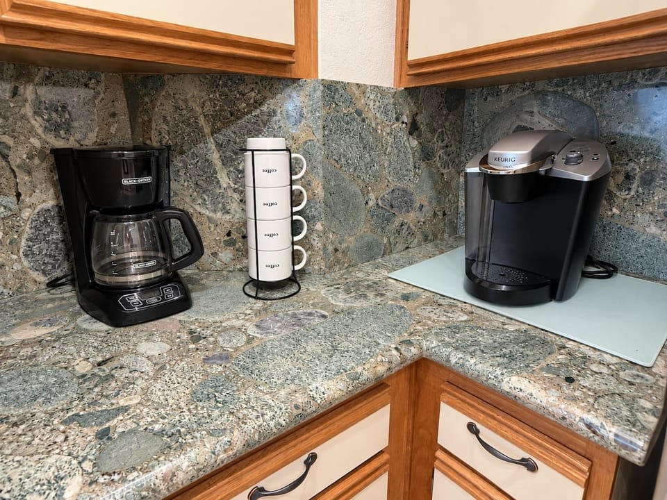 Convenient coffee maker available for your morning routine.
