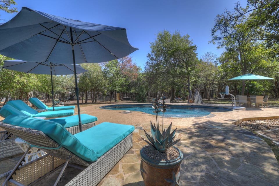 Relax in style with comfy loungers under the shade of large umbrellas. 