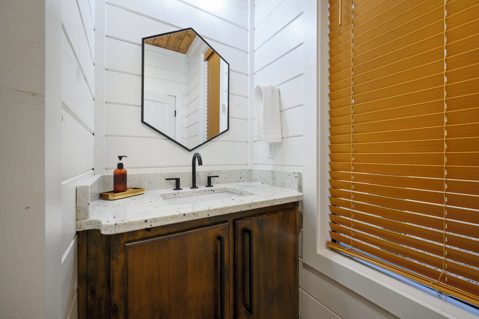 Bright, stylish bathroom vanity with modern fixtures and ample counter space. 