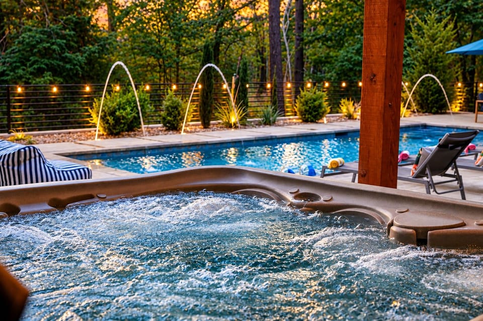 Private pool and hot tub with gorgeous water features, creating the perfect outdoor oasis! 