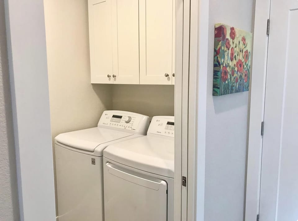 Full size laundry next to the main floor powder bathroom. Soaps are provided.