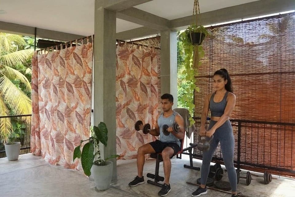 Get your workout on in our open air yoga shala. Behind the curtain is our massage area. 