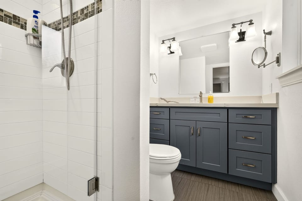Bright modern bathroom with walk-in shower and stylish vanity