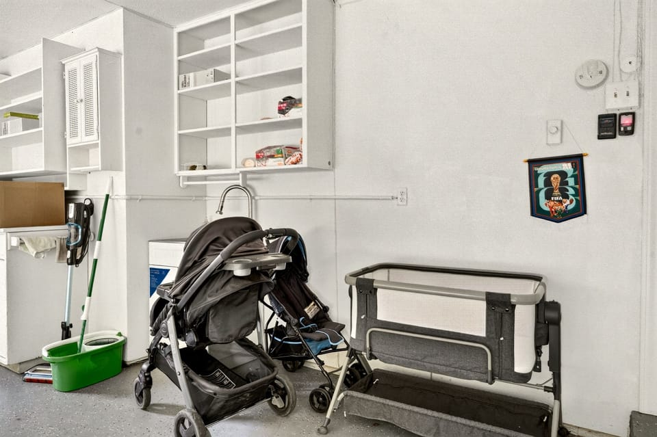 Family-friendly utility space with stroller, bassinet, and built-in storage