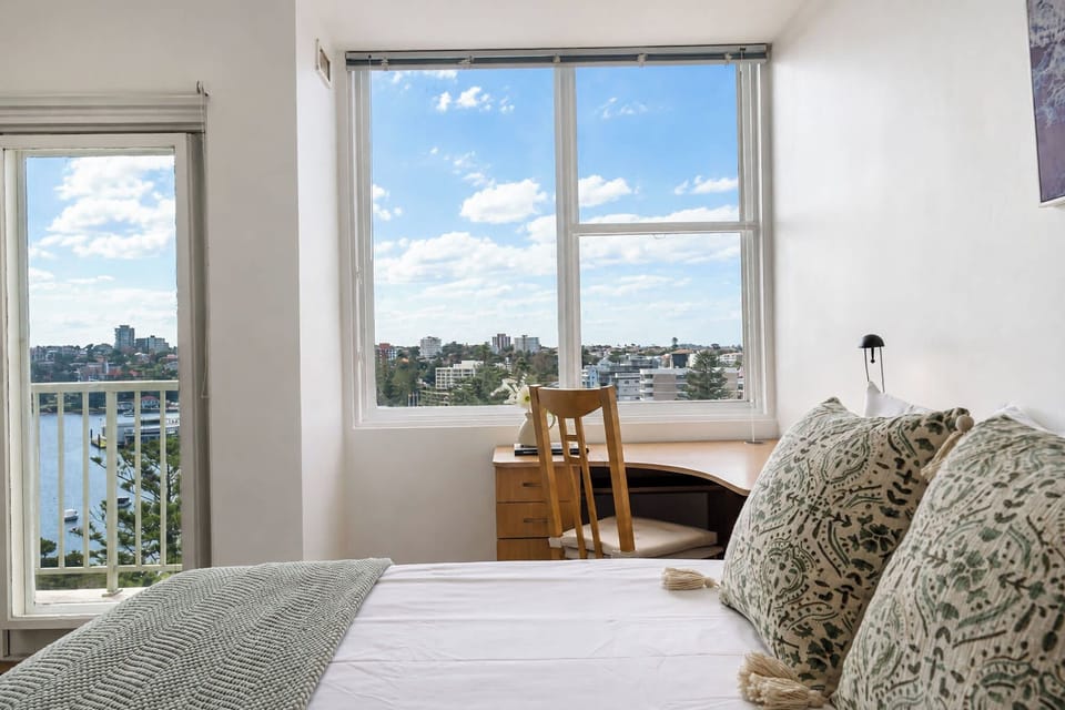 Harbour-view bedroom with dedicated workspace