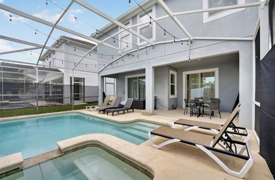 Relax in the comfort of a screened‑in pool deck.