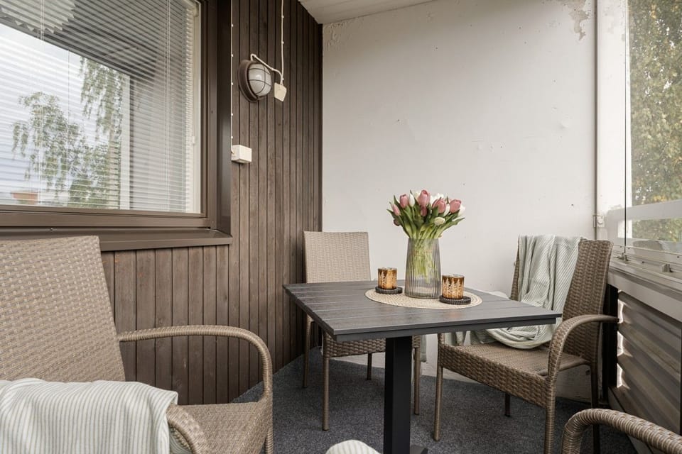 Enjoy a meal or your morning coffee outside regardless of the weather in this fully glass-enclosed, protected space. The sturdy dining setup gives you a quiet, fresh-air alternative to eating in the main kitchen.