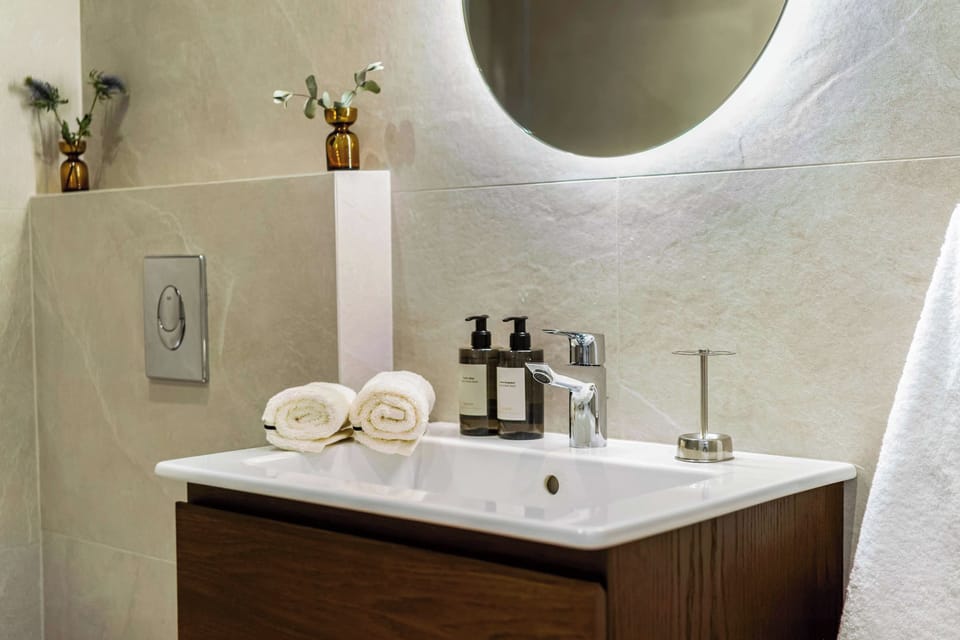 Bathroom vanity with illuminated mirror