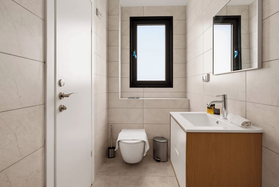 Start your day feeling invigorated under the incredible overhead rainfall shower in this bright space.