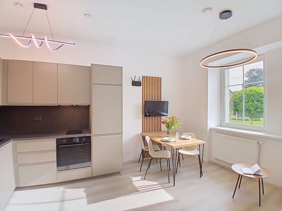 Furniture, Interior Design, Flooring, Wood, Floor, Ceiling, Light Fixture, Lighting, Room, Chair