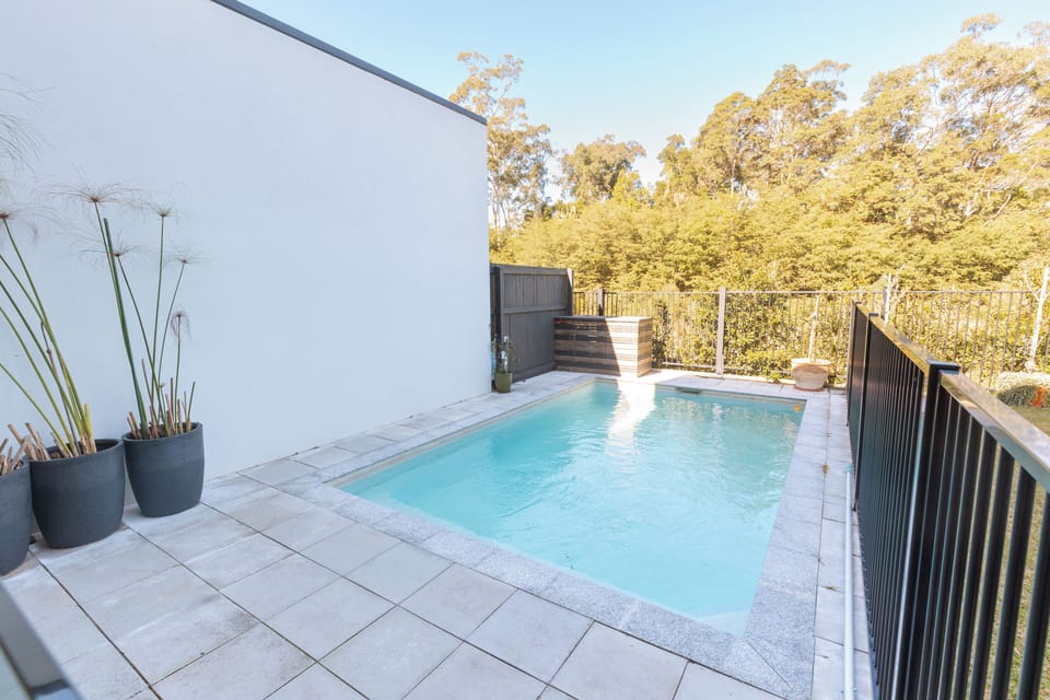 Private plunge pool with serene bush views and modern outdoor style