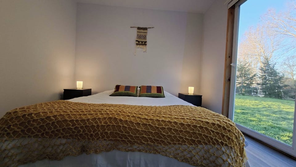 Main bedroom with double bed and garden window