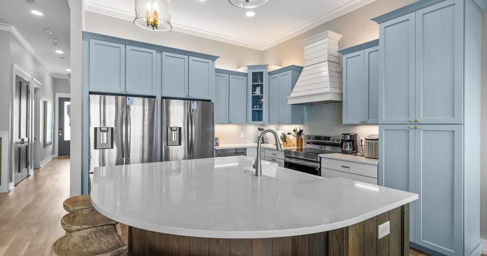 The main-floor half bath includes one of two washer/dryer sets​