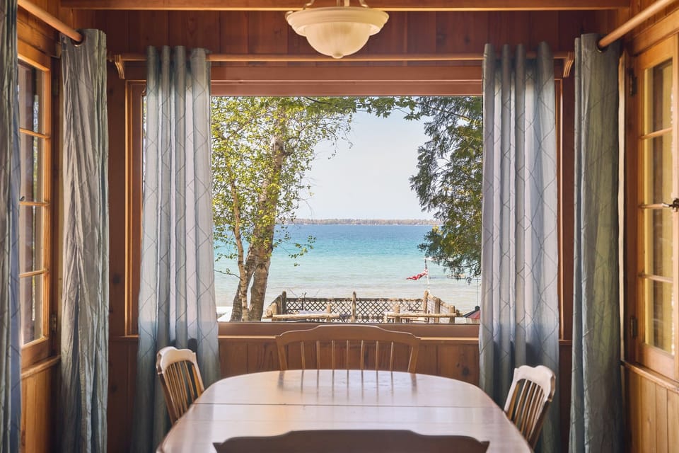 Dine with a view! Enjoy meals together while taking in the beautiful waterfront views through the large picture window—bringing the lake right into your cottage experience.