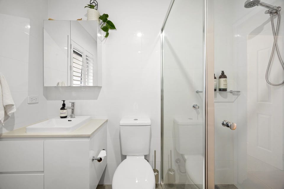 Freshen up after a day exploring Adelaide in the bathroom, with a shower and everything close at hand for an easy evening routine.