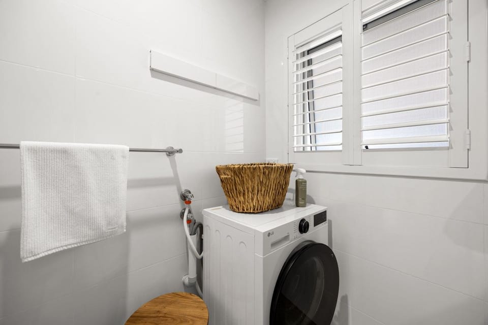 Pack a little lighter and refresh clothes whenever you need with a washing machine tucked conveniently into the bathroom for effortless longer stays.