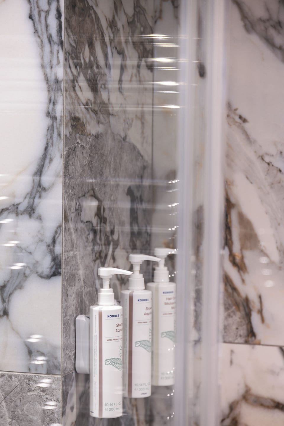Modern bathroom with walk-in shower and premium amenities, designed for comfort and convenience.