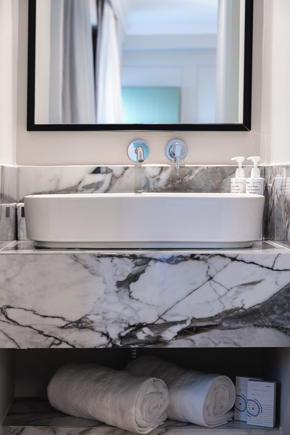 Modern bathroom with walk-in shower and premium amenities, designed for comfort and convenience.