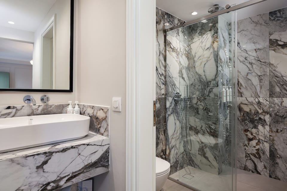 Modern bathroom with walk-in shower and premium amenities, designed for comfort and convenience.