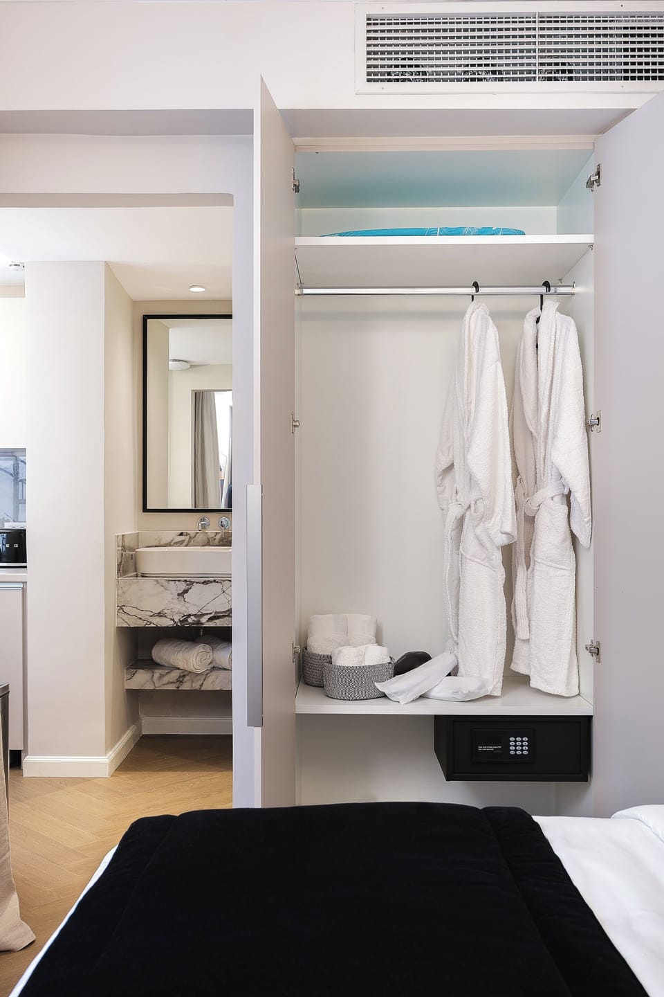 The suite also includes a wardrobe with a safe.