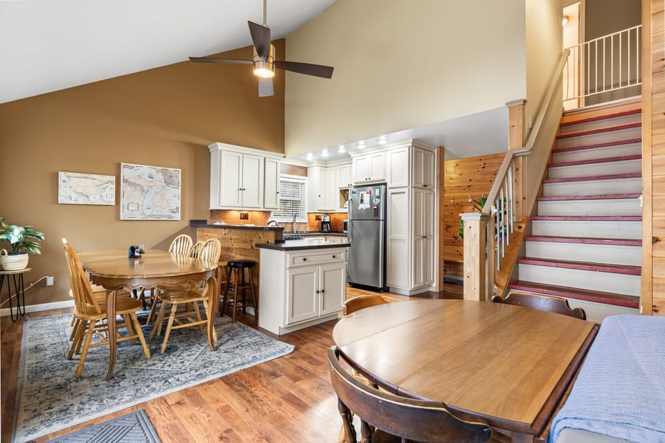 Dining and kitchen under the vaulted great-room ceiling