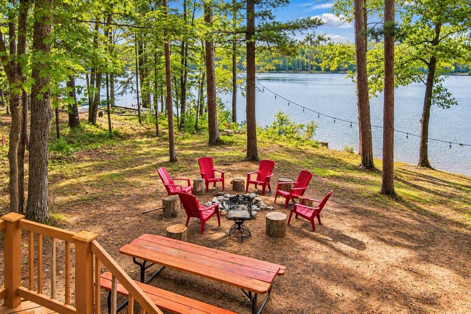 The view from the deck down to the fire pit and the lake
