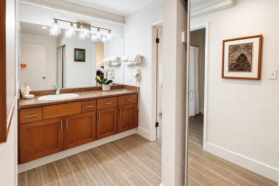 Primary bathroom at Napili Point B31 — a second vanity nook with mirror and natural light for effortless morning routines NAP-B31