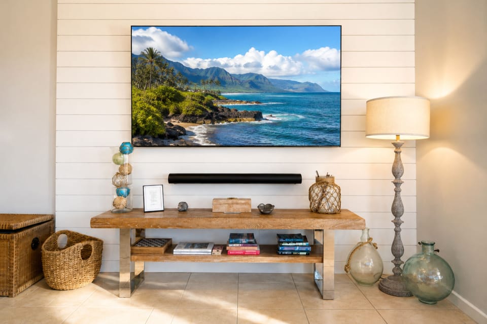 Enjoy movie nights from your comfortable living area, complete with a large TV and bright coastal surroundings. KBV-32B3
