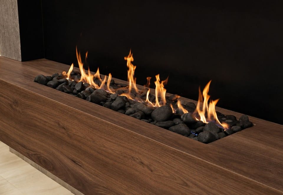 Fireplace Feature: Elegant fire display with smooth stones, perfect for evenings of relaxation!