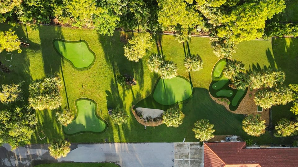 Outdoor Oasis: Tee off in style on lush, beautifully landscaped private putting greens!