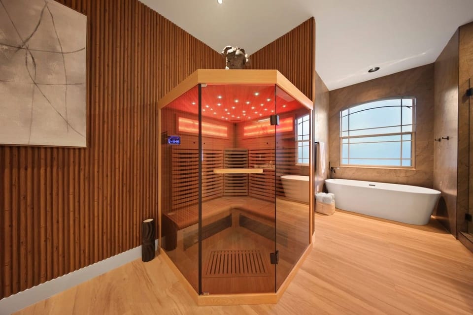 Sauna Oasis: Unwind in this radiant sauna with stunning views and luxurious finishes!
