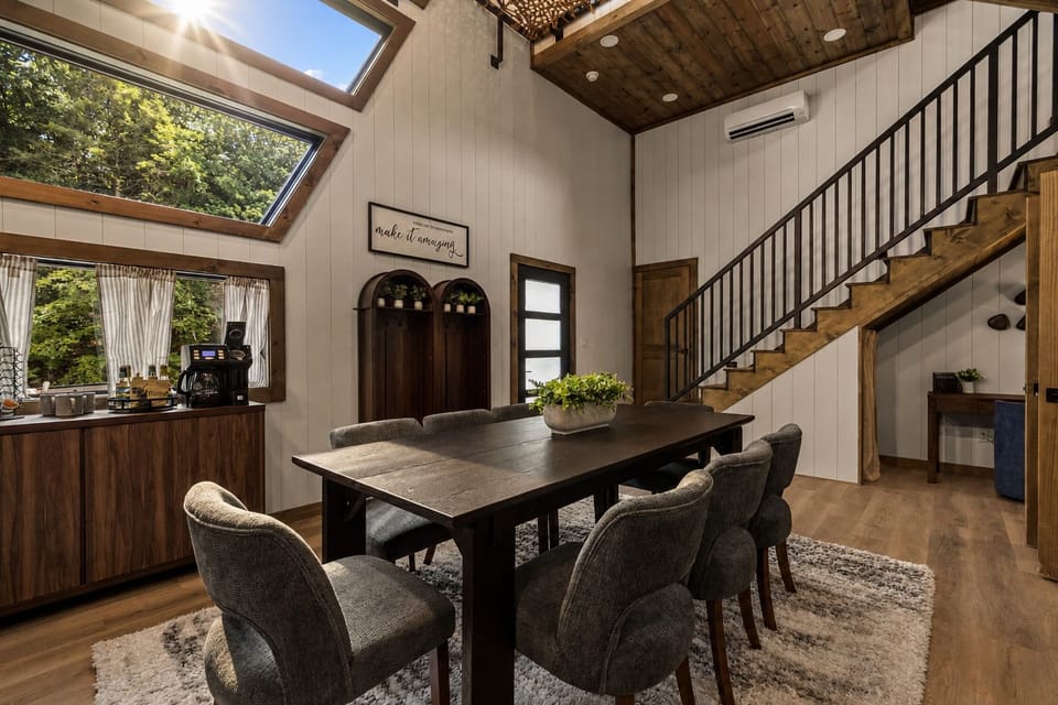 Modern entryway with rustic staircase and convenient in-home laundry