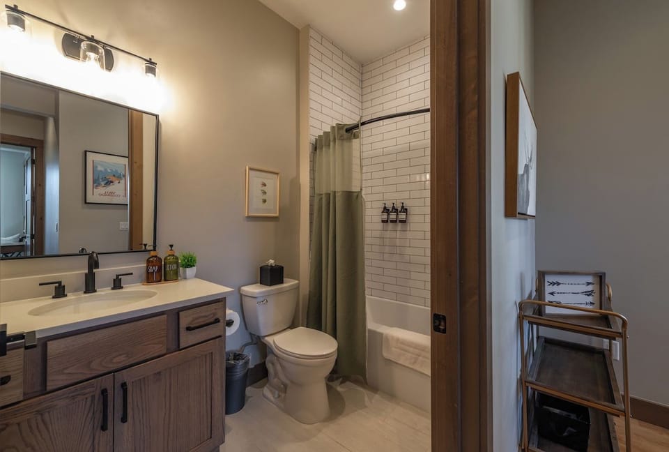 Shared bathroom accessed through the hallway