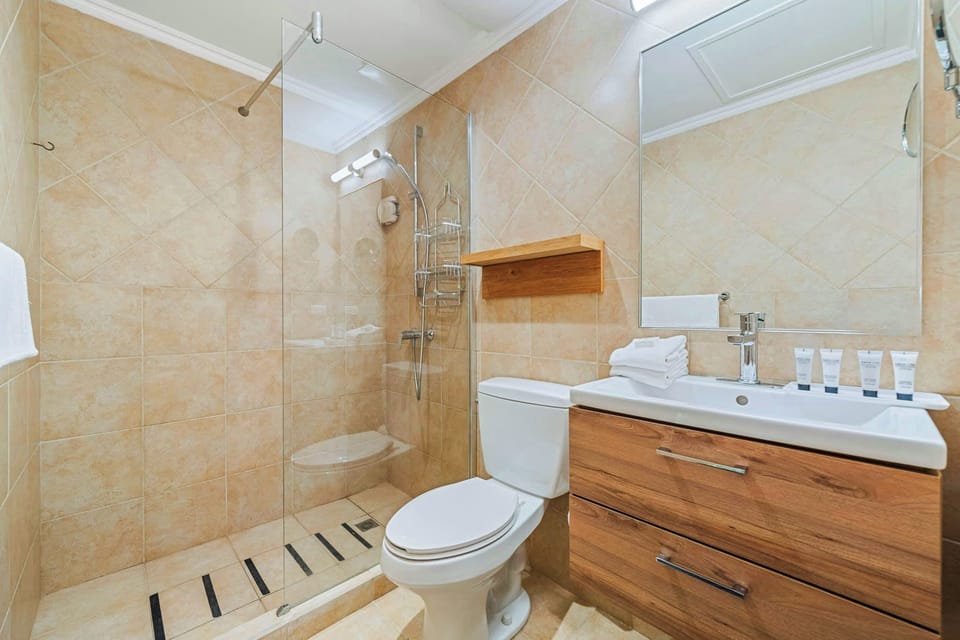 Bathroom 1 features a walk in shower