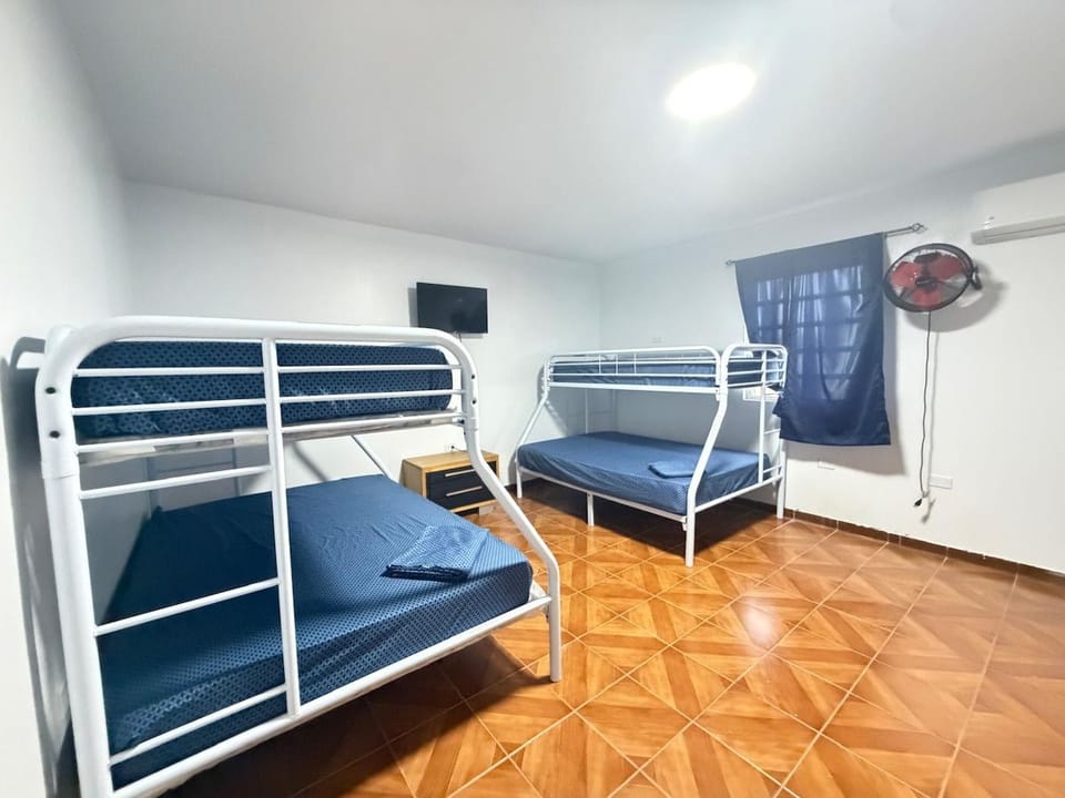 Comfortable bedroom with two twin/full bunk beds. Enjoy the fan & TV.